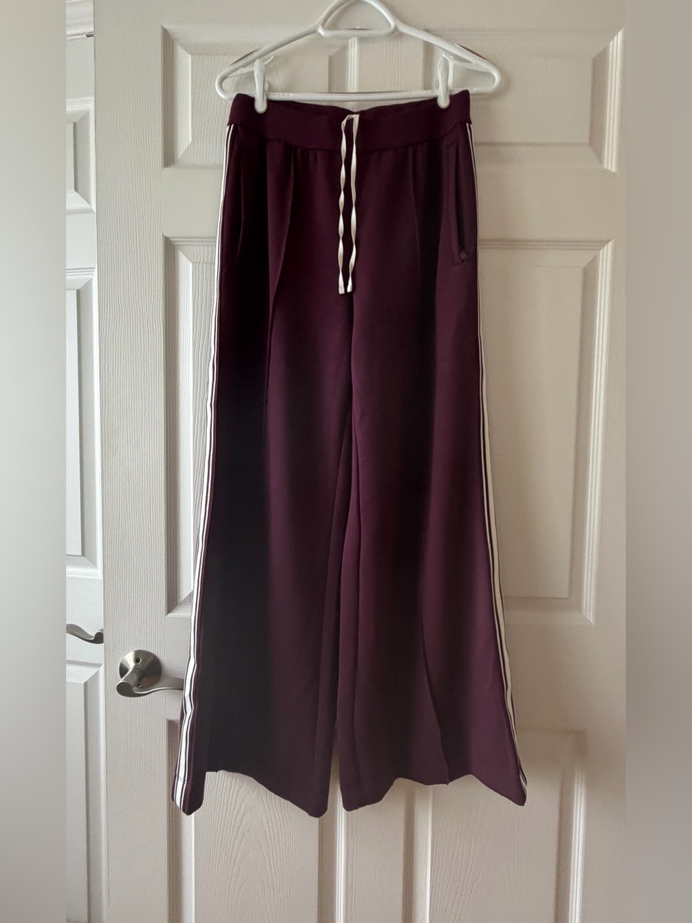 ALO Yoga Wide-Leg Track Pants in Plum with White Side Stripes - Picture 2 of 10